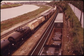 Tank cars running the levee beside the Kansas River.