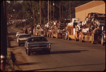Twelfth Street at dawn, haulers along the curb.
